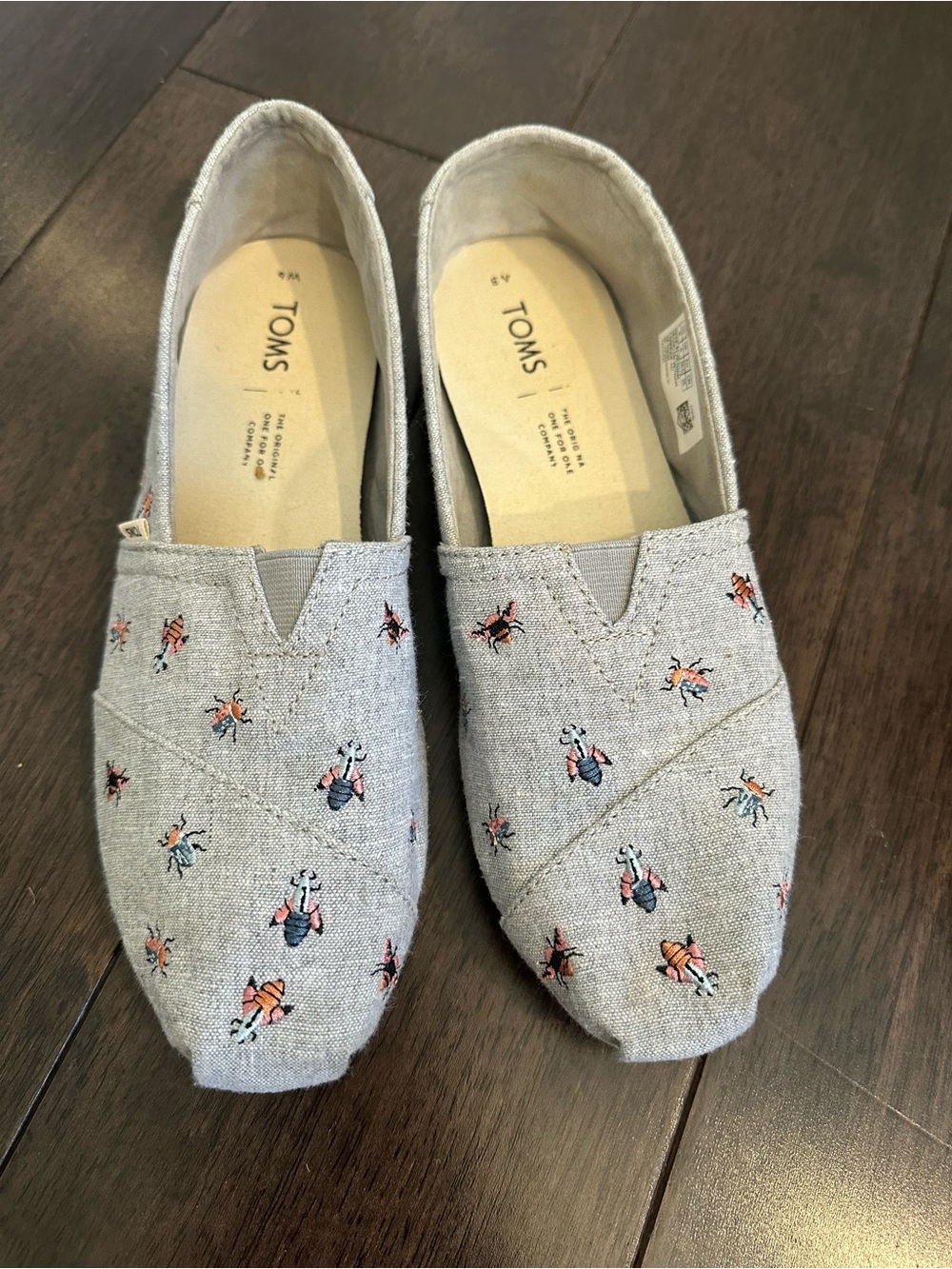 TOMS Light Blue Slip-Ons with Bee Embroidery